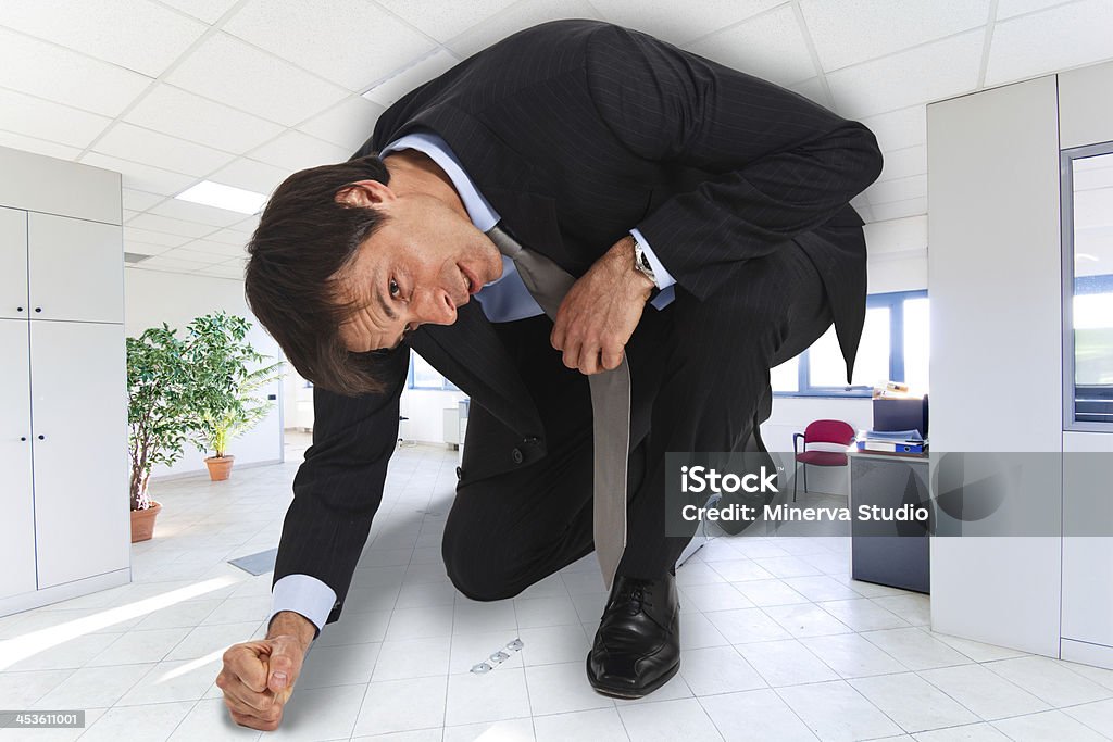 Small business Portrait of businessman in a small office Too Small Stock Photo