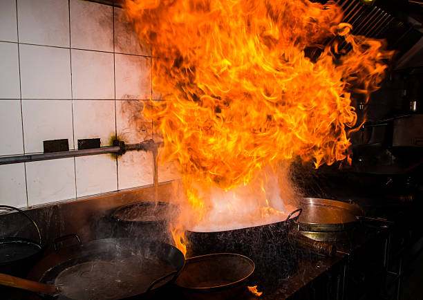 Stir fire very hot Fire gas burn is cooking on iron pan,stir fire very hot kitchen on fire stock pictures, royalty-free photos & images