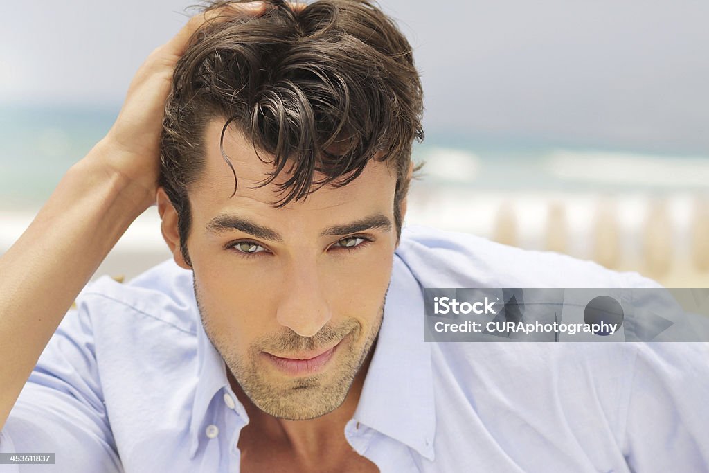 one Outdoor bright natural portrait of a handsome successful man with nice smile Adult Stock Photo