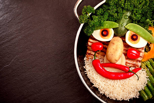 istock Pan on Slate Surface with Food Face. Healthy Lifestyle Concept. 453614103