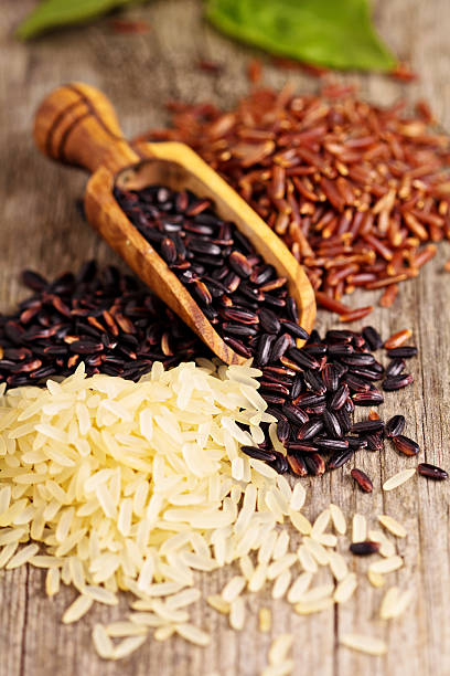 istock Variety of rice on a wooden background 453615475