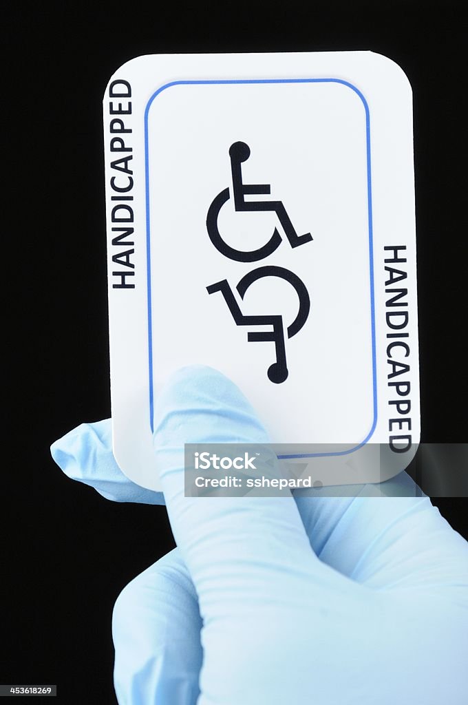 장애 카드 및 라텍스 장갑을 - 로열티 프리 인간 손 스톡 사진