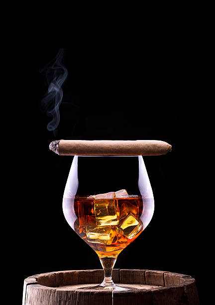istock Cognac and Cigar on black with vintage barrel 453622537