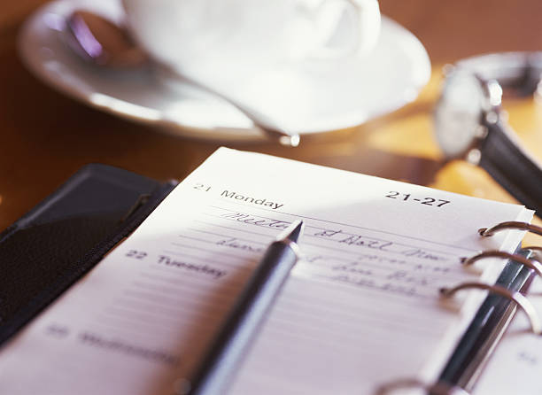istock Marking appointments on a calendar over morning coffee 453626645