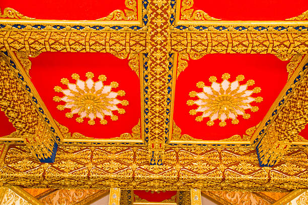 istock Buddha temple wall and thai style ceiling decoration 453636923