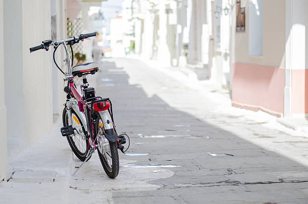 A bike in a street of Andros, Greece.
