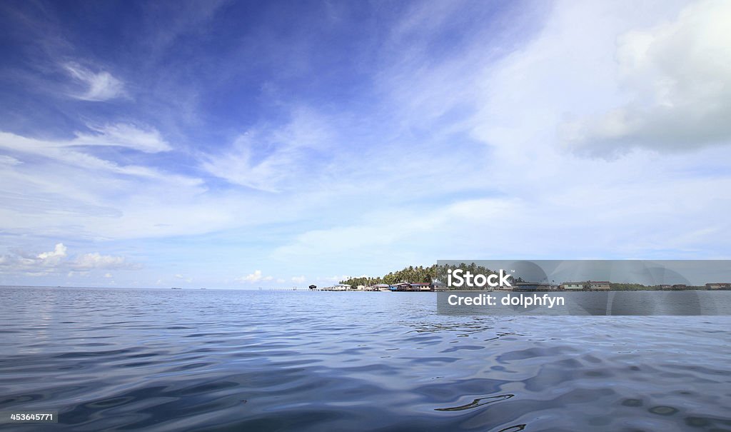 Island with beautiful sky paradisiac island in the middle of the ocean. Beach Stock Photo