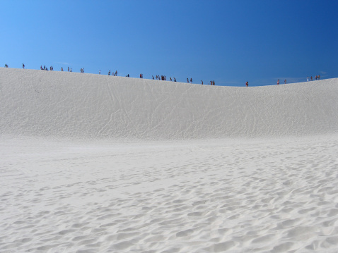 Africa people going on the dune full sunny day