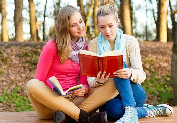 istock Beautiful women reading 453650835