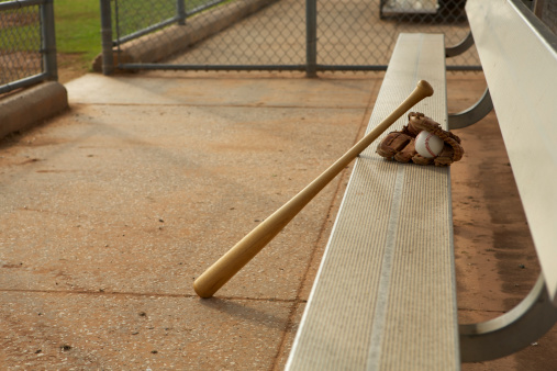 Baseball & Bat and Glove in the Dugout