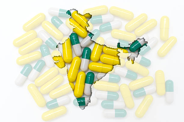 Outline map of india with pills in the background stock photo