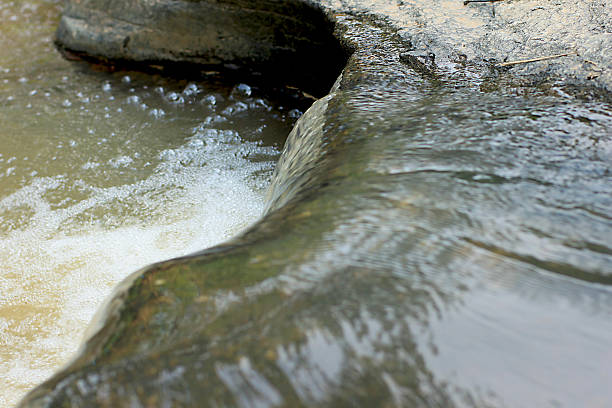 istock Running Water on the Rock 453651713