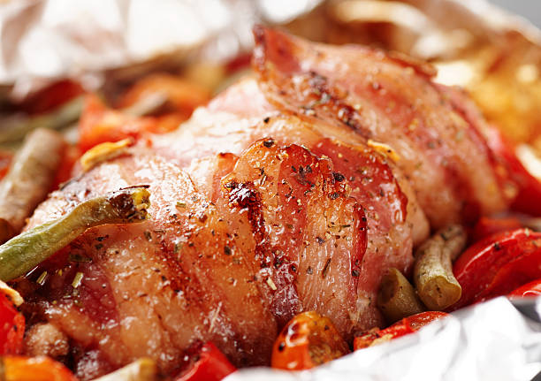 istock Chicken breast wrapped in bacon and fried 453652051