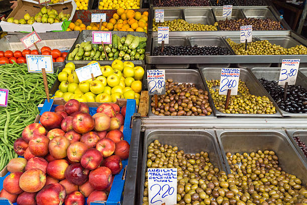 Olives, fruits and vegetables for sale at a market