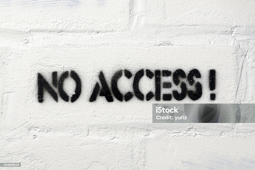 no access no access exclamation stencil print on the white brick wall Accessibility Stock Photo