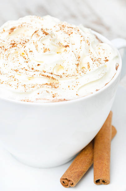 istock cup of cocoa with cinnamon and whipped cream close-up 453661699