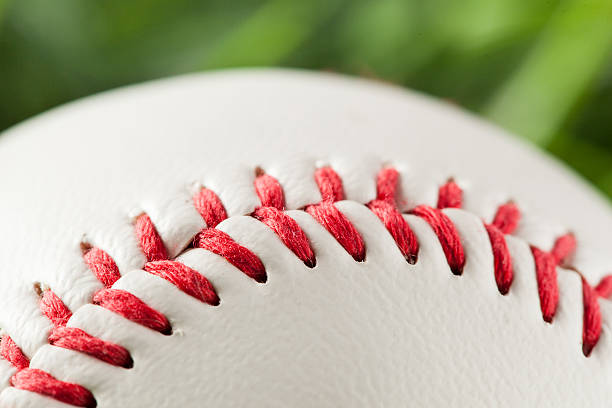 istock New White Baseball in green grass 453667397