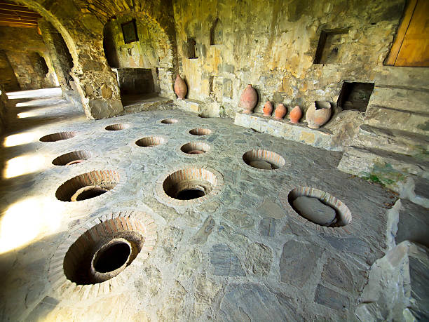 an old wine cellar with holes in the ground Traditional Georgia wine celler in Nekresi monastery complex, Kakheti region, Georgia. kakheti georgia stock pictures, royalty-free photos & images