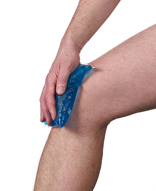 istock Cool gel pack on a swollen hurting knee. 453667675