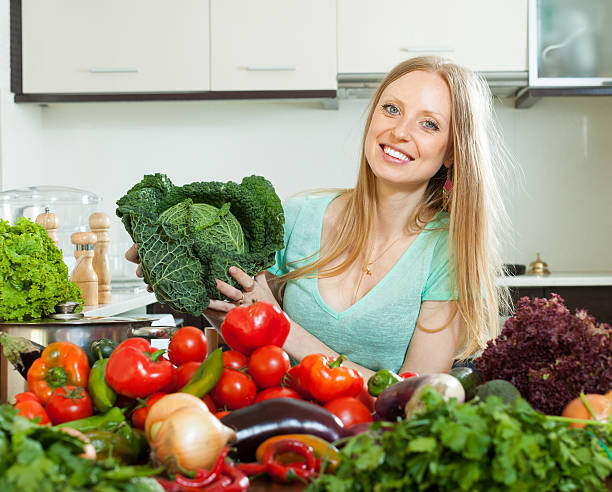 istock Portrait of  housewife with  cabbage and  vegetables 453673421