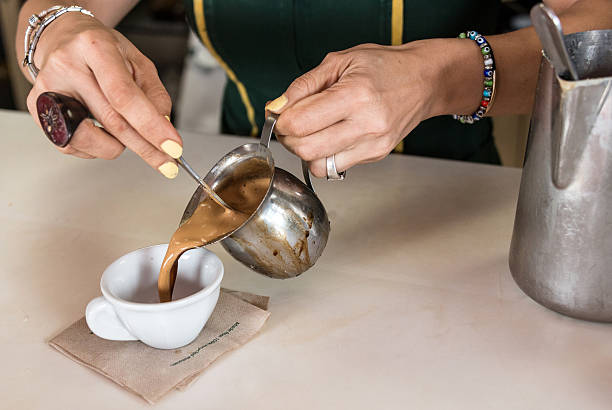 Woman serving a cuban coffee