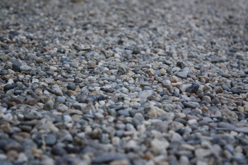 A road covered with fine gravel. Close up.