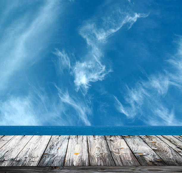 istock Sea and sky against wooden floor 453680215