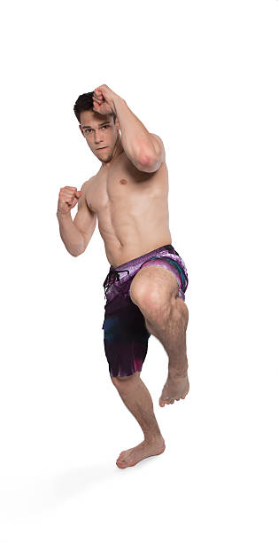 istock Portrait Of Young Man Kicking 453682857