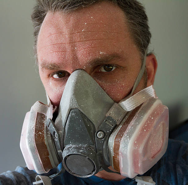 istock Man wears respirator 453682987