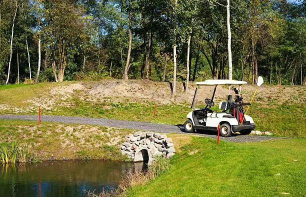 Golf-cart car on golf course landscape