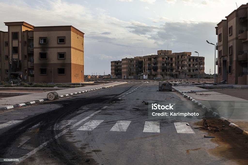 Destroyed Tawergha Tawergha, Libya - Februari 26, 2012: The ghost town Tawergha is situated half an hour’s drive from Misrata that is the closest neighbouring city. When Gaddafi attacked Misrata, many Tawerghans were part of his forces. Today, the two cities are bitter enemies. Libya Stock Photo