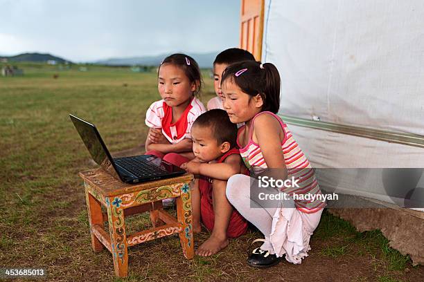 Mongolian Children Using Laptop Stock Photo - Download Image Now - Green Color, Home Interior, Laptop