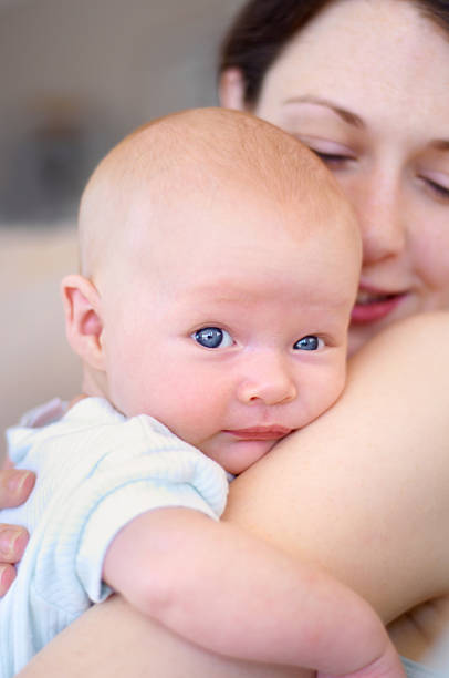 istock Safe in his mother's arms 453694141