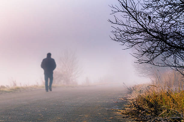 istock men silhouette in the fog 453696617