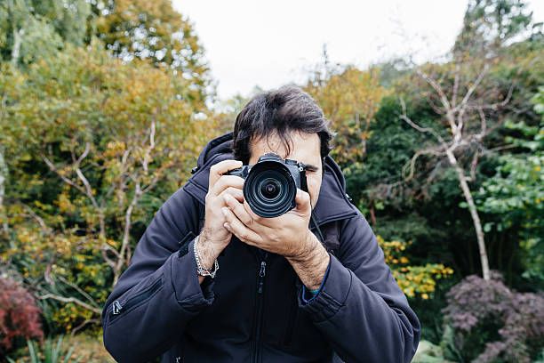 istock Photographer in London park during a service 453698083