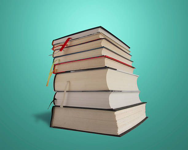 istock Stack of books isolated in green background 453724019