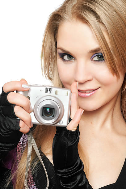 istock Smiling beautiful blonde holding a photo camera 453724145