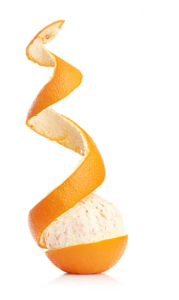 istock orange with peeled spiral skin 453724973