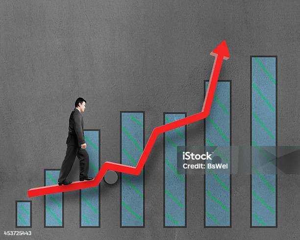 Businessman Walking On Growth Red Arrow With Chart Stock Photo - Download Image Now - Achievement, Adult, Business