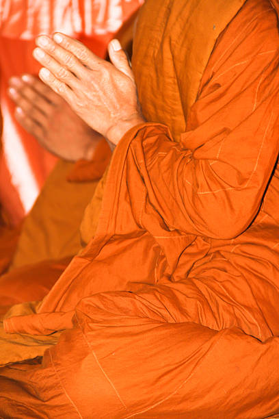 istock Hands of Buddhist monk praying 453729025