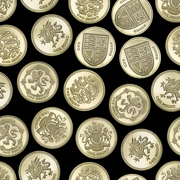Seamless texture of British One Pound coins on black background One pound coins, extremely sharp and create a nice pattern. three lions england stock pictures, royalty-free photos & images