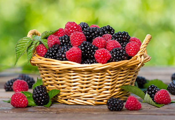 istock Raspberry and blackberry in the basket 453730459