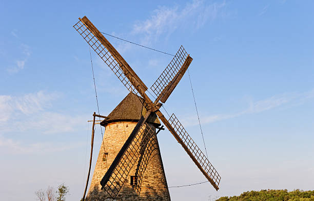 istock Old wooden mill against the blue sky 453731717