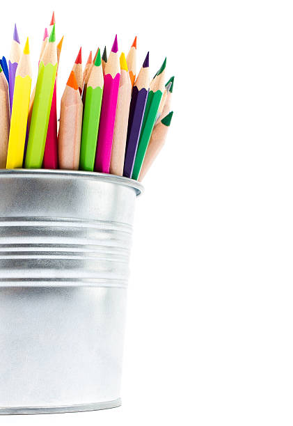 istock Color pencils in aluminum pencil  holders isolated on white back 453734689