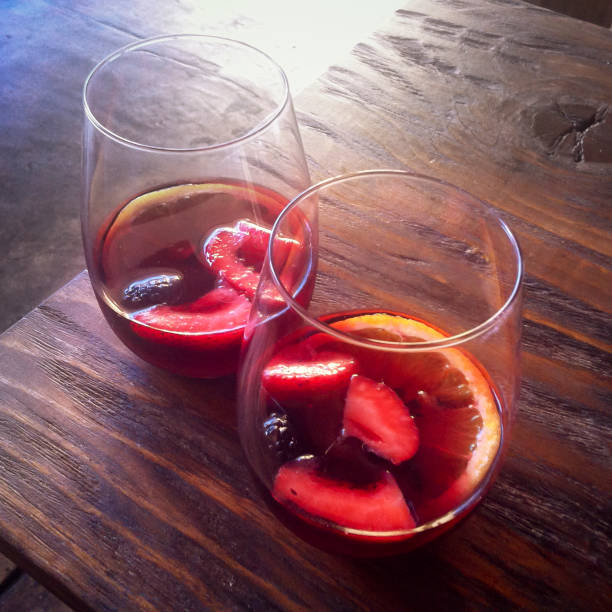 Two Glasses of Red Sangria on a Wood Table stock photo