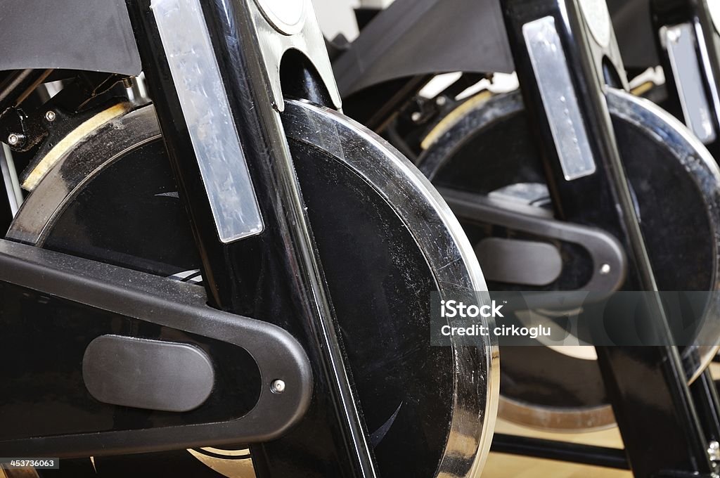 Group of exercising bicycles at fitness studio Activity Stock Photo