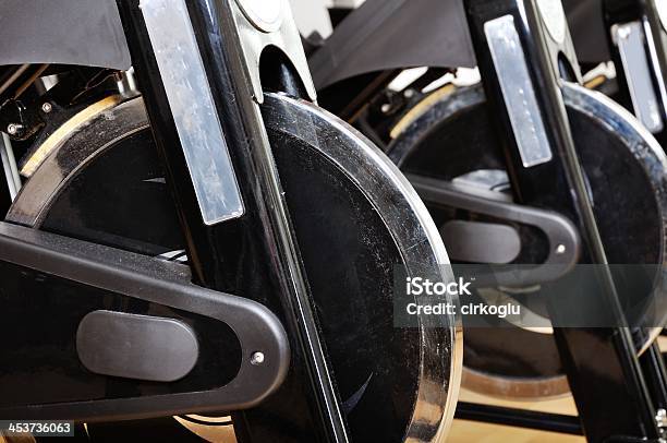 Group Of Exercising Bicycles At Fitness Studio Stock Photo - Download Image Now - Activity, Arts Culture and Entertainment, Bicycle