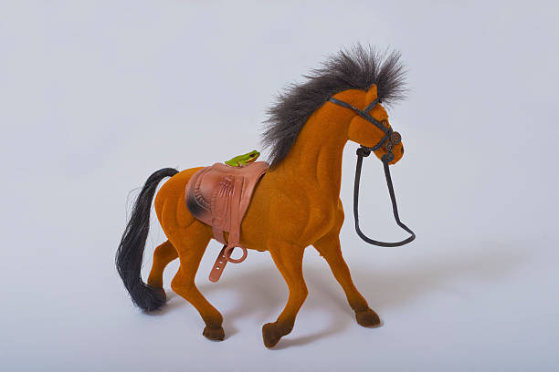 istock Green Frog Hitching a Ride on Toy Horse 453736081