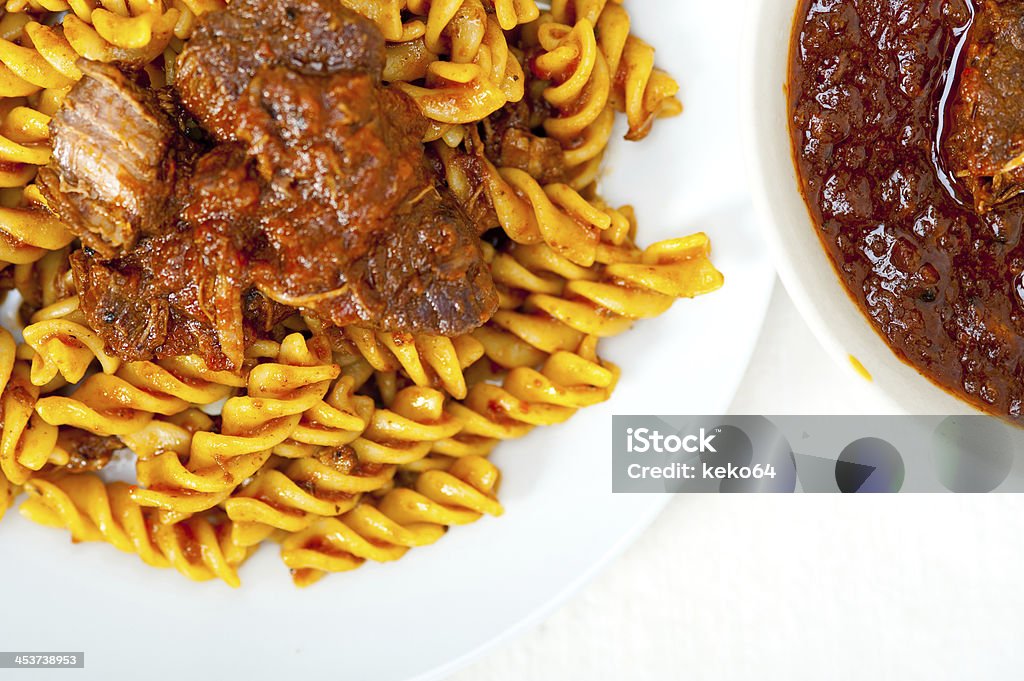 fusilli pasta with neapolitan style ragu meat sauce fusilli pasta al dente with neapolitan style ragu meat sauce very different from bolognese style Beef Stock Photo