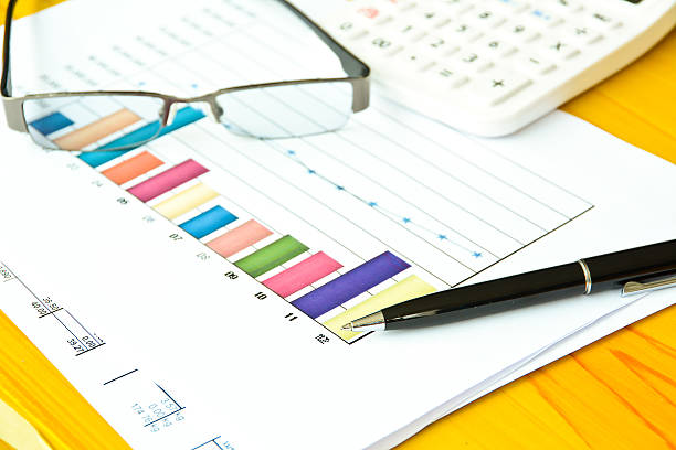 istock Graph with glasses and ballpoint pen 453740035